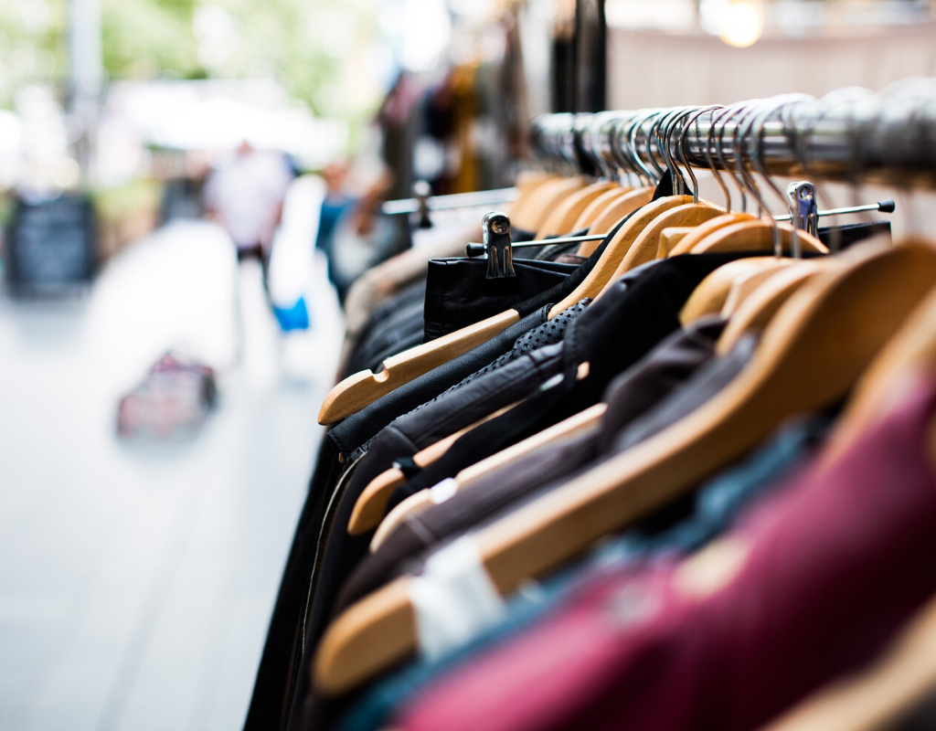 Clothes in hanger rack in open market